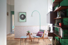 01 This colorful space is done with a green statement wall, colorful wallpaper and lots of floating shelves and drawers