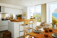 01 This cozy kitchen features three areas, a kitchen, a mini bar and a dining space