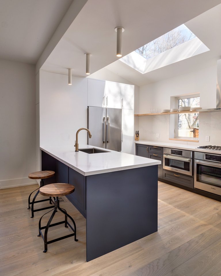 Skylights bring more natural light to the kitchen, industrial stools are great for the breakfast space