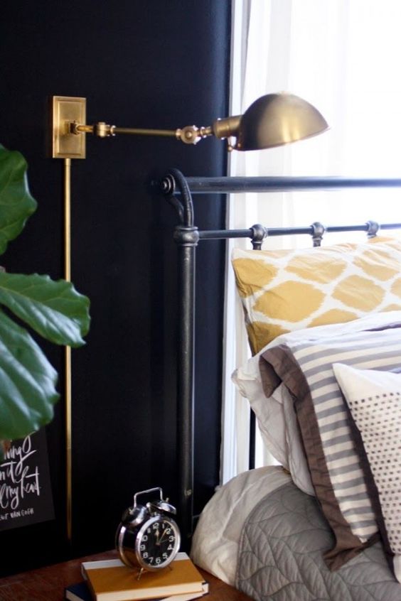 a chic vintage industrial wall sconce in brass will make an accent in any bedroom