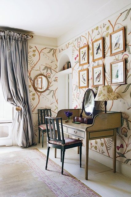 a gorgeous vintage-inspired home office with floral wallpaper in light shades