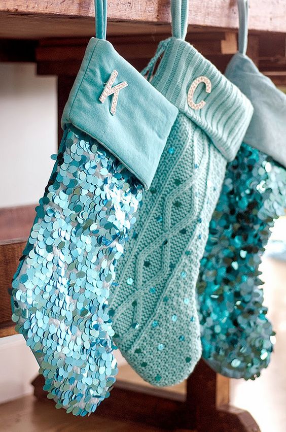 cable knit and sequin blue stockings with monograms are cool for a shiny touch