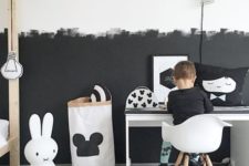 03 a Scandinavian kid’s room with a partly black and partly white wall with a brushstroke pattern