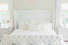 03 a creamy bedroom with a blush chandelier and a floral print upholstered bench