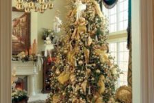 03 a large Christmas tree with lots of vintage ornaments in gold looks amazing