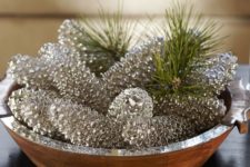 03 a wooden bowl with silver pinecones and pine branches for a sparkly glam look