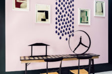 04 The workspace is done with an accent pink wall, wih a checkerboard table and lots of artworks