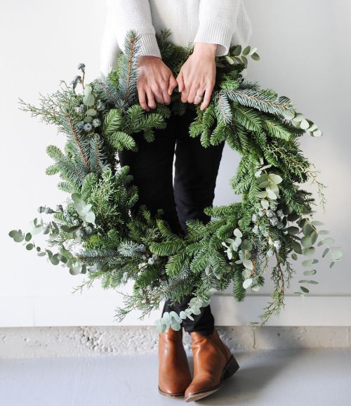 a lush evergreen wreath with no decor will focus on its natural beauty and fit any space