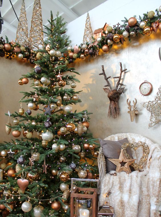 copper, gold and pearl Christmas decor with lots of ornaments looks refined