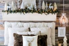05 a headboard display with deer, shiny Christmas trees, a fir garland and lights