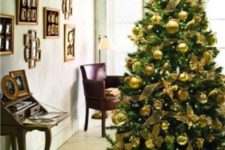 05 an emerald tree with gold ornaments looks chic and contrasting, this is a glam combo for the holidays