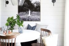 06 a cool farmhouse breakfast nook with a white pedestal table and some wood chairs looks very cozy and inviting
