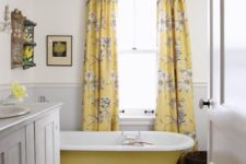 06 a farmhouse bathroom with yellow floral print curtains