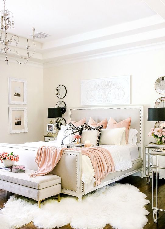 a light grey bedroom with touches of pink and lavender for a romantic feel