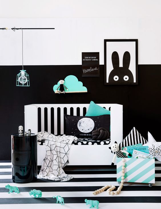 A partly black and white wall makes a bold accent and mint touches make the room fresher