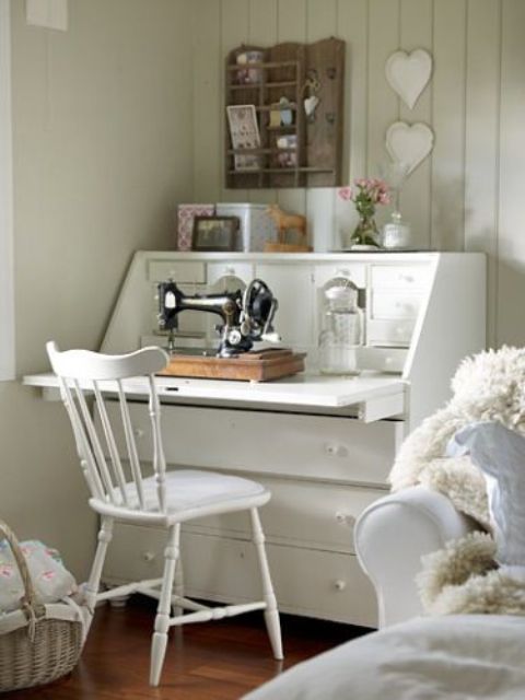 a vintage-inspired sewing nook in white with small and cute details can be placed in the bedroom