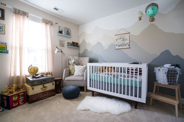 adventure-inspired nursery in grey and green shades with lots of fun decor