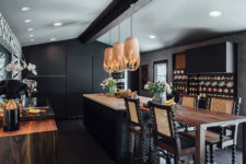 07 Rich-colored wood touches, eye-catchy stools and pendant lamps over the kitchen island add eye-catchiness to the space