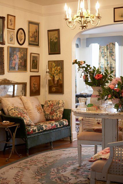 a floral rug, upholstery and pillows add English chic to the space