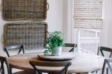 07 a rustic space with baskets on the wall, a wooden dining set and some neutral Roman shades