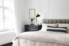 09 The master bedroom is done in neutrals plus grey, and there are some metallic touches for a chic look