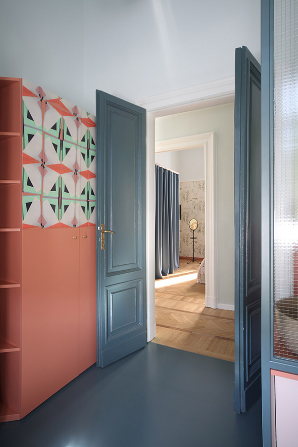 There's a coral wardrobe with bold geometric mosaics to fit the furniture