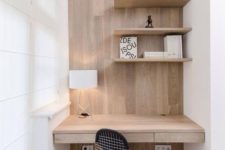 09 a minimal home office corner is done in white and natural wood, the furniture is clean and sleek