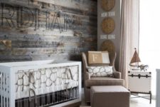 09 a rustic themed nursery with a reclaimed wood wall, burlap and wicker touches