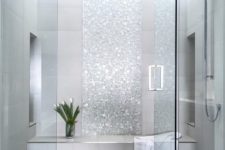 09 a shower and steam room done with grey tiles and shiny silver accents looks very glam and cute