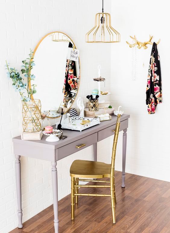 vintage grey desk with drawers and gold accents for a outique-style look