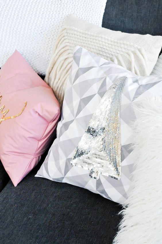 a geometric pillow with a silver sequin Christmas tree can be easily DIYed