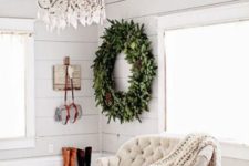 10 a large rustic evergreen wreath with large pinecones will make a statement in any space