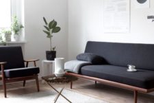 10 a minimalist interior with a Scandinavian feel, wood framed furniture and a jute rug