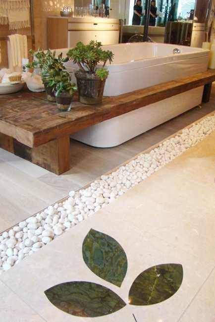 pebbles in between the floor tiles, a wooden bench and potted succulents will create a relaxing ambience