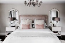 10 pink velvet pillows and white faux fur pillows to make the space glam