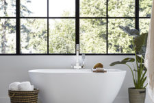 11 The master bathroom features a free-standing bathtub and a glazed wall for cool views