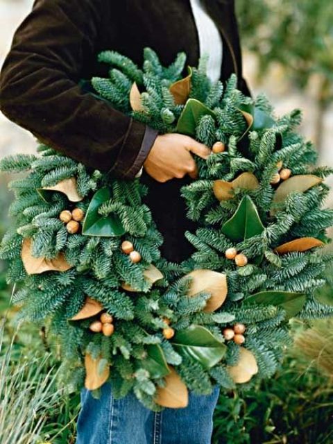 a gorgeous wreath of evergreens, acorns and magnolia leaves for a unique holiday decoration