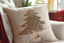 11 a neutral pillow with a champagne sequin Christmas tree looks very holiday-like