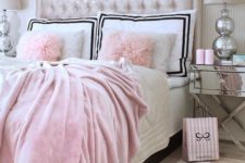 11 a pink velvet blanket, faux fur pillows and a creamy upholstered velvet headboard