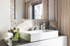 11 a shiny metal tile wall to highlight the sink and vanity and make them more glam