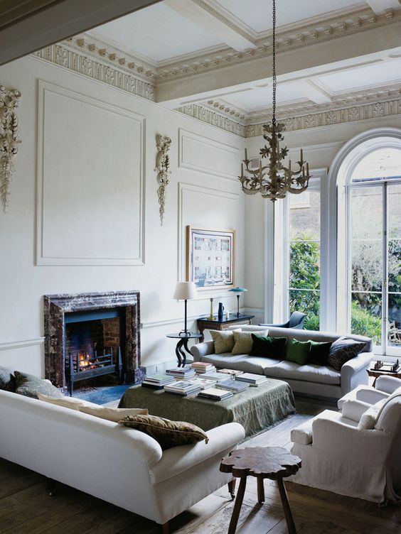 A built in fireplace clad with marble makes this space special and cozy