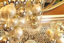 12 a festive gold and pearly ornament display in jars