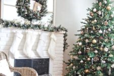 12 a mix of silver and gold ornaments stands out in an emerald Christmas tree