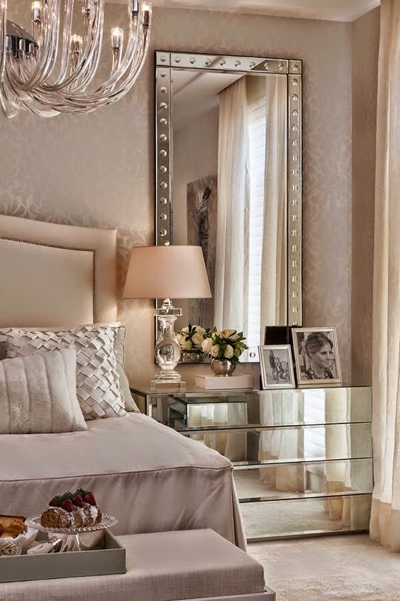 mirrors and mirrored nightstands are great to add a shiny touch to your space