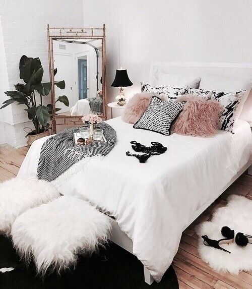 faux fur pillows, stools and a rug make the space adorably girlish