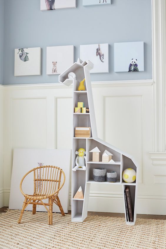 a giraffe shelving unit functions both as a storage piece and a toy