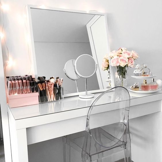 a modern square mirror put on the vanity and an additional small one