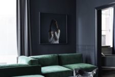 14 a moody minimalist space done around an emerald croner sofa and a grey coffee table