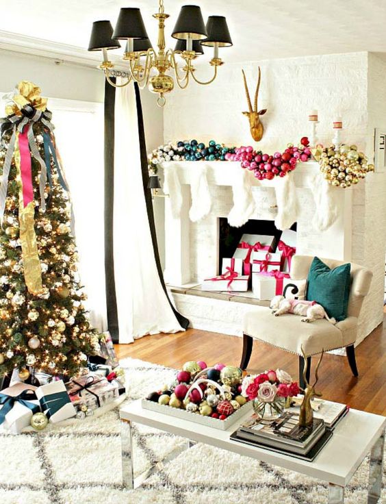 an oversized glam fireplace garland made of ornaments of different colors and a matching display