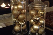15 display some gold and gold glitter ornaments in jars to get chic Christmas decor